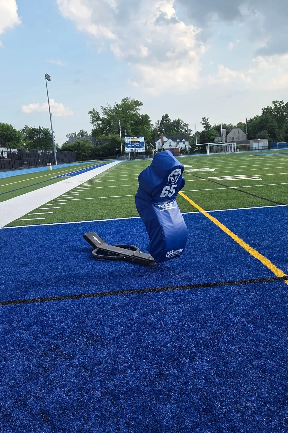 A new blue flip sled standing on the turf at Carlton Smith Stadium